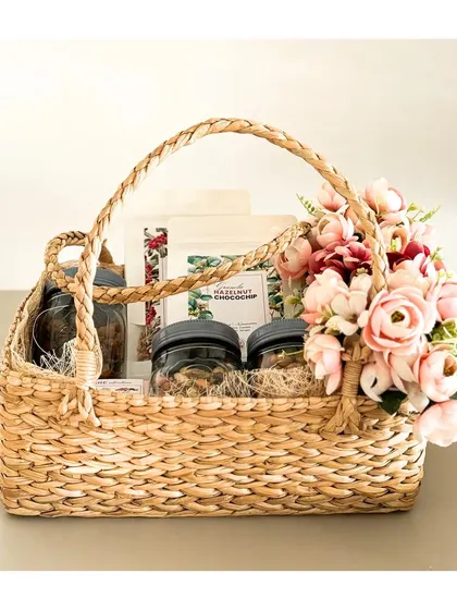 This is our luxurious seagrass basket, which has a beautiful texture and a sturdy handle. It's perfect for creating a high-end, impressive gift hamper.