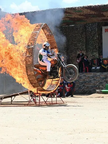 A thrilling motorcycle stunt through a ring of fire. It's crucial to be ready to capture fast-moving, dramatic moments like this.