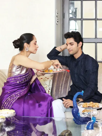 Celebrate the bond of love with timeless traditions and luxurious style. A sister performs the tika ceremony for her brother during Rakhi, using my elegant pooja thali to make the moment extra special.