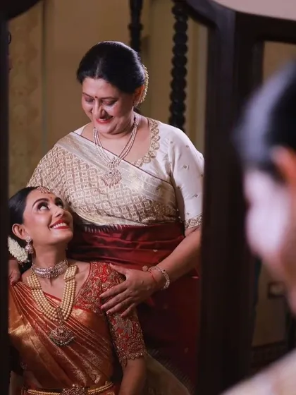 A beautiful reflection of a mother's love. I designed coordinated blouses for both mother and daughter, ensuring they both looked stunning on this special day.