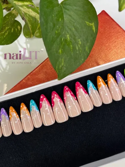 A colorful take on the French manicure, this press-on set features dripping neon tips in shades of lime green, purple, orange, and pink, complete with tiny white dots.