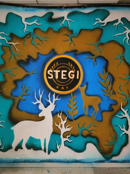 A direct, close-up shot of the Stegi entrance mural, highlighting the 3D effect created by the layered colors.