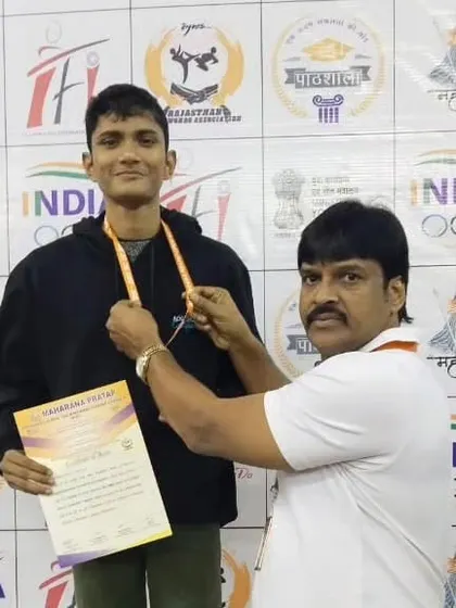 Rudra Roy receiving his silver medal. His dedication to the sport is commendable.