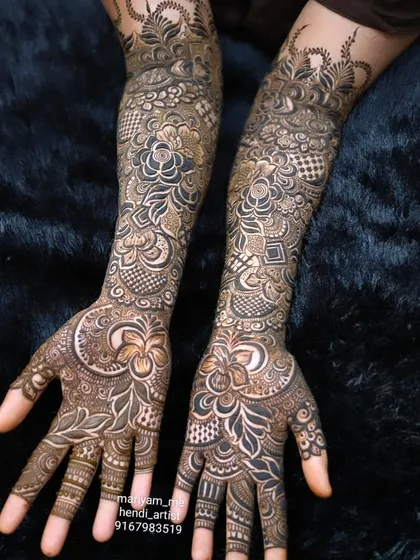A close-up of a full bridal mehendi, showcasing the intricate details and craftsmanship.