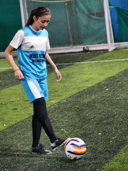 A player practices her ball control, a fundamental skill that we emphasize in every training session.