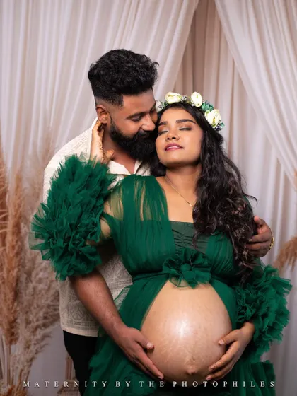 An intimate and sensual portrait of the couple, the bare bump and loving embrace creating a powerful and beautiful image.
