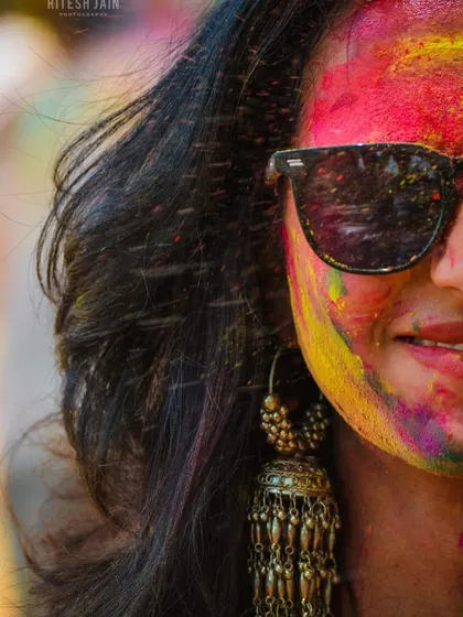 A close-up shot showing the joy and vibrant colors of Holi. I make sure my events are full of energy, creating an atmosphere where everyone feels free to celebrate.