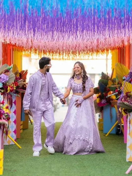 A colorful start to a beautiful journey. This couple's entry was framed by a vibrant floral and fringe curtain, setting a fun and festive tone.