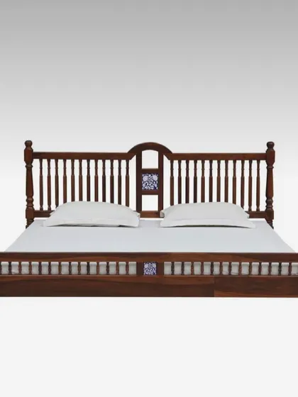 A frontal view of the classic wooden bed, showing the symmetry of the headboard and footboard design. We build our furniture to be solid and durable, ensuring it lasts for generations.