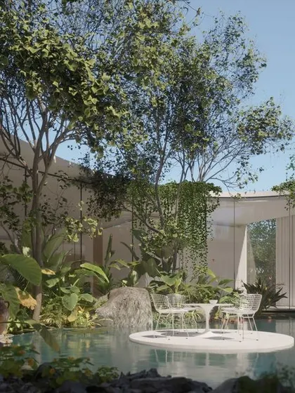 A view into the heart of a Vastu-compliant residence in Hyderabad. The design creates a private oasis with a central water body and lush planting, where a floating platform provides a unique spot for quiet contemplation, surrounded by nature.