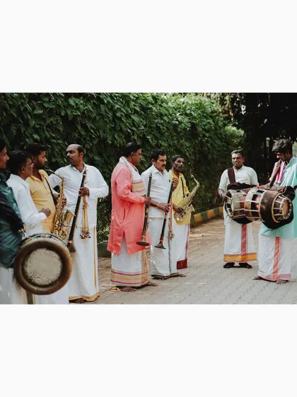 A shot of the traditional band playing music at the wedding, setting a festive tone.
