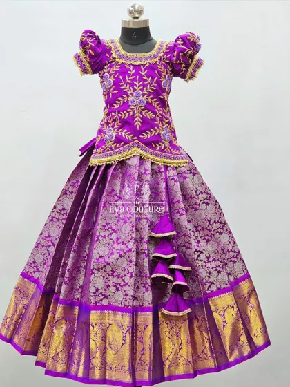 A closer view of the embroidered purple blouse, paired with a matching purple Banarasi skirt.