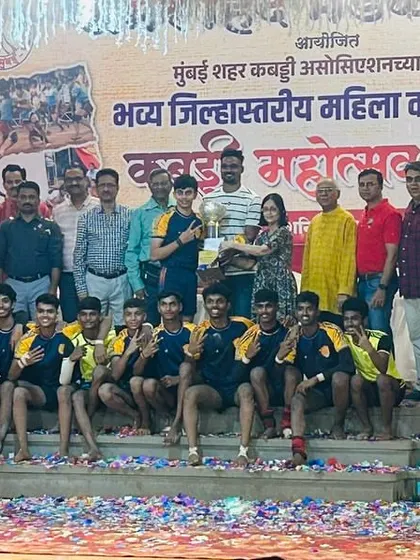 The junior team on the victory stage, covered in confetti after being crowned champions.