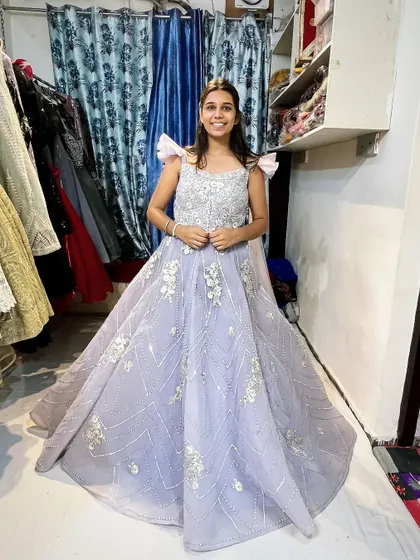 A happy client smiling in the lavender gown. It’s a versatile piece that suits many different special occasions.