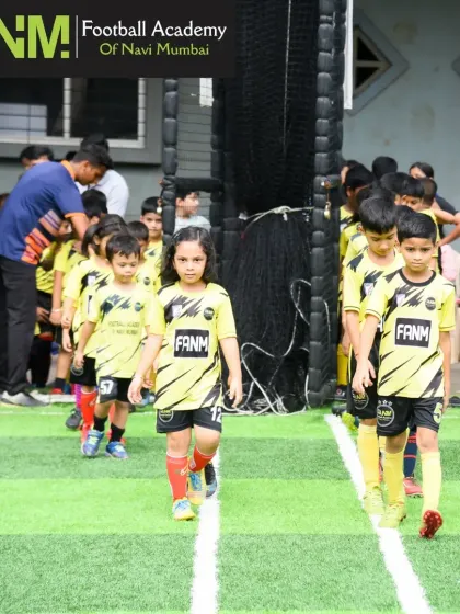 Our youngest players, including girls and boys, line up and get ready for their training session. I focus on creating an organized and welcoming environment for kids of all ages.