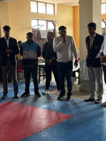 A guest speaker addressing the students during the Bahadurgarh Open Khel Karate Championship.