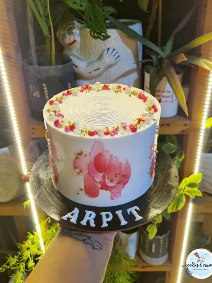 I love doing textured cakes. This design uses a palette knife to create abstract floral patterns in shades of pink, finished with a sprinkle of gold.