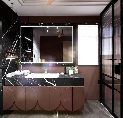 A close-up of the vanity area, showcasing the custom cabinetry with a curved, scalloped design. The large, back-lit mirror and black marble countertop complete the luxurious and modern aesthetic.