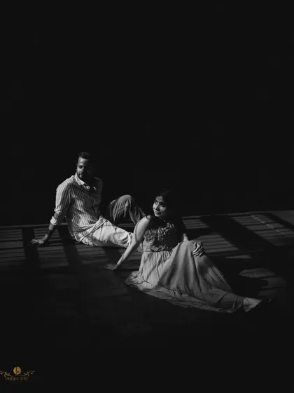 An artistic black and white shot using dramatic shadows and light. This creative portrait captures the couple in a unique, moody, and memorable way during their pre-wedding shoot.