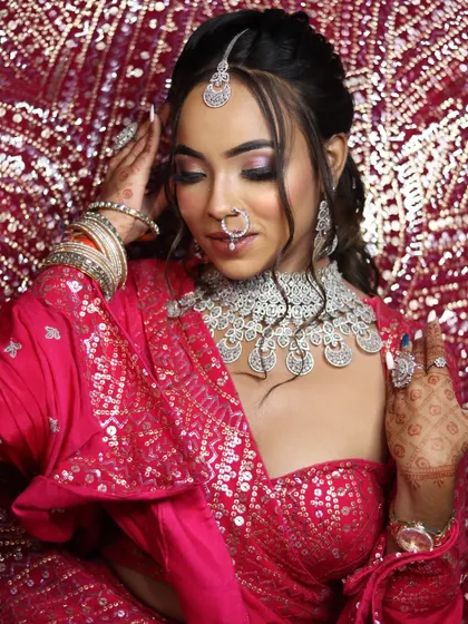 The intricate details of the henna and the perfectly manicured nails are part of the complete bridal look we teach.