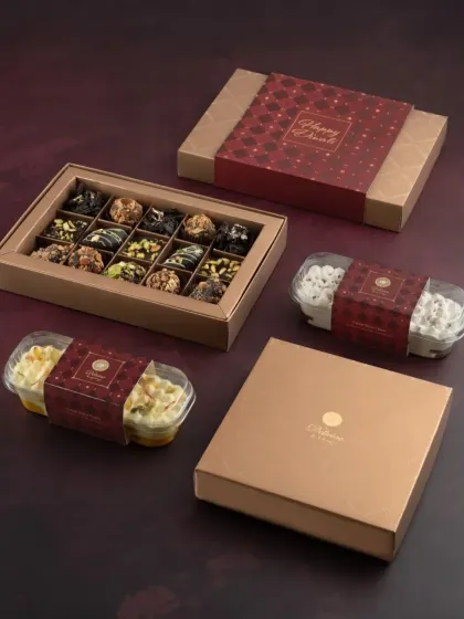 Celebrate Diwali with our beautifully crafted gift boxes. This set includes our special eggless and no added sugar chocolates, along with other festive treats.