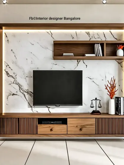 This floating TV unit combines a marble backdrop with fluted wood details on the drawers. The design is minimalist yet provides ample storage.