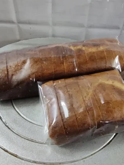 Two Mawa Rawa loaf cakes of different sizes, sliced and wrapped. I can bake them in various sizes depending on your needs.