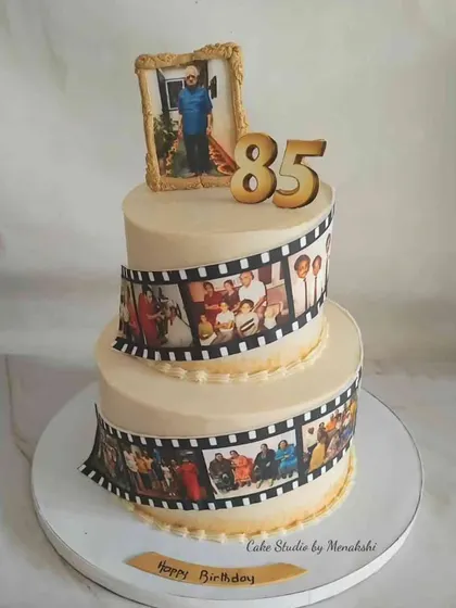 A life story told in cake. This two-tier 85th birthday cake features an edible photo reel of cherished memories, celebrating a beautiful journey. It’s a deeply personal way to honor a loved one.