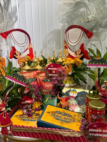 Another angle of the festive Rakhi gift arrangement, showing how we layer different elements, from food products to decorative props, to create a full and abundant look.