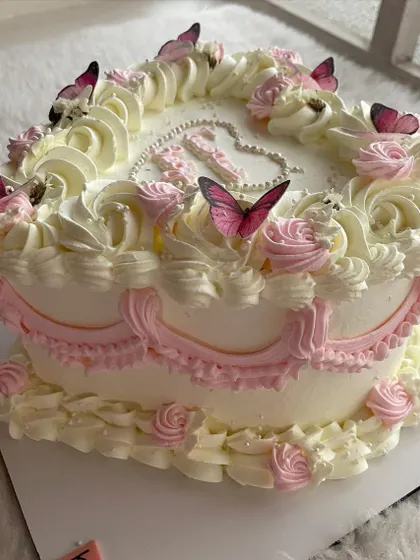 A close-up of the piping details on the vintage heart cake. Each swirl is piped by hand to create this classic, romantic look.