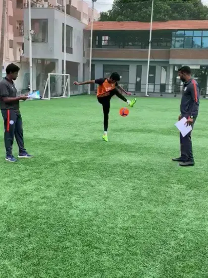 Shreyas demonstrating his high-kick ball control during his signing, a display of the technical skill I teach.