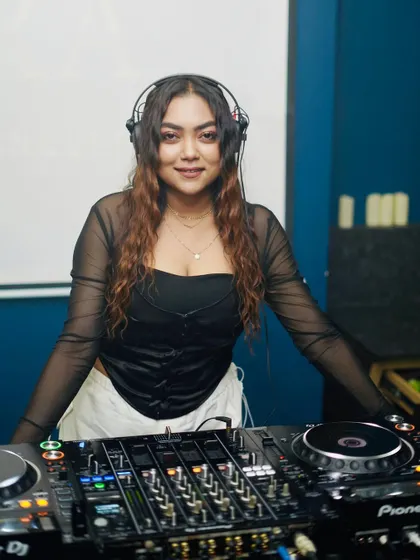 A smiling portrait of me at my workstation, happy to be doing what I love.