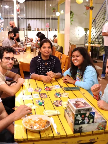 The joy and excitement of a game well played. This happy group captures the energy of our board game meetups.