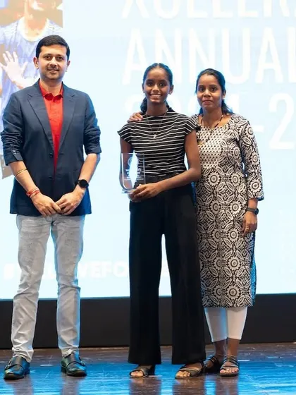 An Xcelerate player and her mother on stage, a proud moment for the Bravo family.