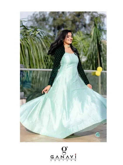 The flowing skirt of this mint green gown creates beautiful movement, making it a joy to wear. The design is a perfect blend of classic elegance and contemporary style.