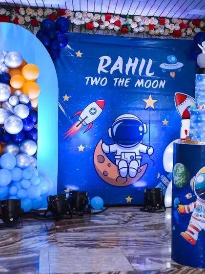 Another view of the astronaut and rocket-themed birthday decorations.