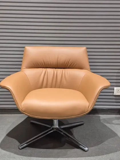 The same swivel lounge chair design is also available in a classic tan color.