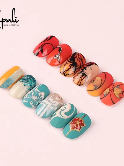 A collection of random designs I've created, playing with different techniques like stamping, glitter, and abstract patterns.
