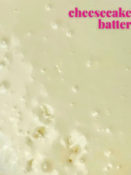 Next comes the smooth, creamy cheesecake batter. We pour this right over the cookie dough base before baking it to perfection.