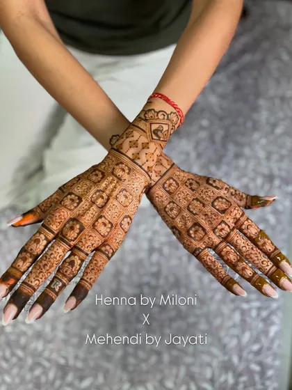 Both hands of the grid-work design, showing the beautiful symmetry.