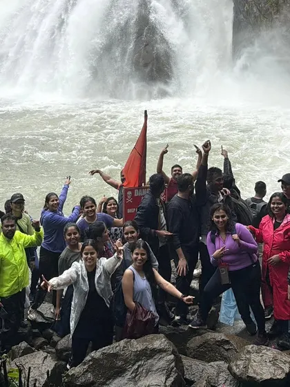 The pure joy of reaching Dudhsagar Falls. Our groups celebrate the power and beauty of this magnificent "Sea of Milk," a highlight of our monsoon trekking season in Goa.