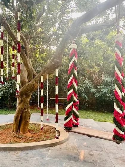 Another angle of the traditional floral swing, showing the intricate weaving of the flowers.