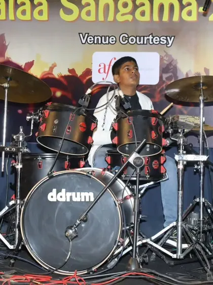 A young drummer in action during the 'Bones' cover at Kalaa Sangama 2023.