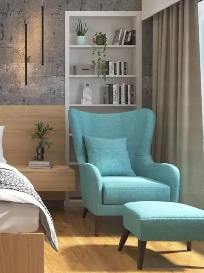 A bright and cheerful reading spot in a bedroom, featuring a comfortable wingback chair and ottoman in a lovely shade of turquoise.