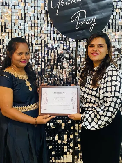 A proud moment for a student as she receives her fashion design certification from our founder.