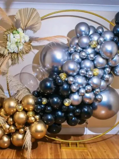 A premium ring decor setup using a chic color palette of black, silver, and gold. The addition of pampas grass gives it a modern, bohemian feel, perfect for a stylish event.