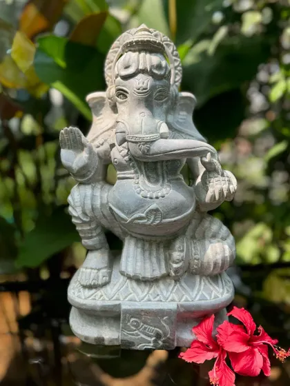 Here is Ganappa, the remover of obstacles, carved from stone. His form, with an elephant head and human body, represents intelligence and strength, making him a perfect spiritual protector for the entrance of a home.