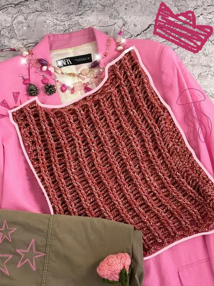 A flat lay of my strawberry jelly top, inspired by the texture of a jellyfish. It’s a unique, ribbed design that’s super versatile and can be dressed up or down.