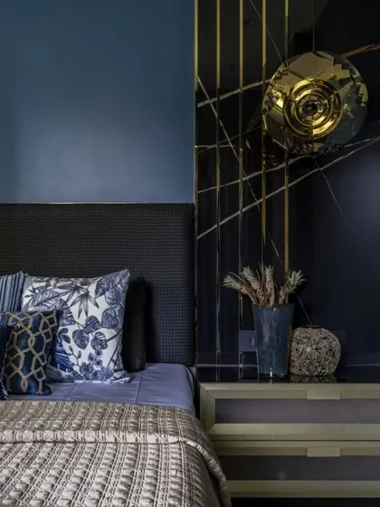 When the client's son asked for a bold, blunt blue, I took it a step further. Midnight blue walls, graphite veneer, and a marble bed-back come together in a masterclass of restraint, balance, and drama.