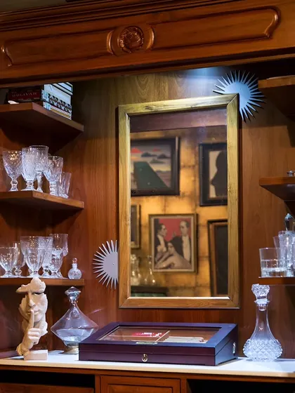 My cabinet of curiosities, filled with crystal glassware and unique sculptures.